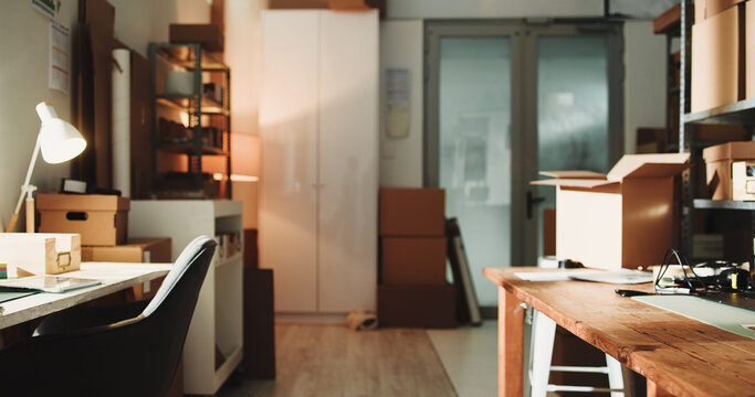 Logistics, empty or boxes in office building, interior or stock space in small business. Distribution, vacant workplace or inventory in supply agency, professional setting or courier setup at startup