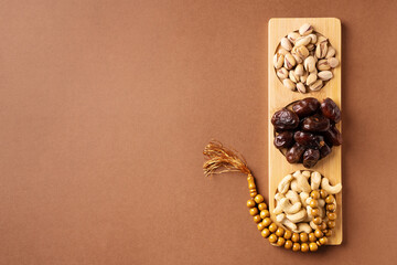 Ramadan kareem background with dates, cashews and pistachios