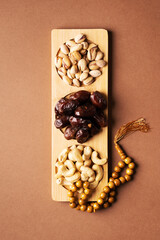 Ramadan kareem background with dates, cashews and pistachios