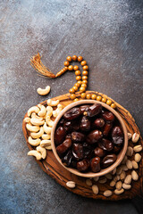 Ramadan Kareem background with dates, cashews and pistachios