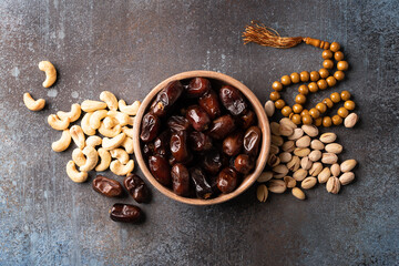 Ramadan Kareem background with dates, cashews and pistachios