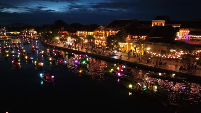 Drone video Hoi An, Vietnam in Quang Nam Province is a popular tourist destination, with colorful lantern boats sailing along the river at night.