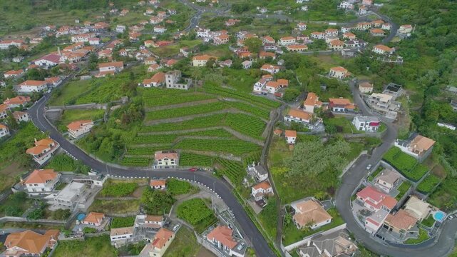 4K video; slow backward drone flight over a village at the north coast of the island of Madeira, Portugal. 
