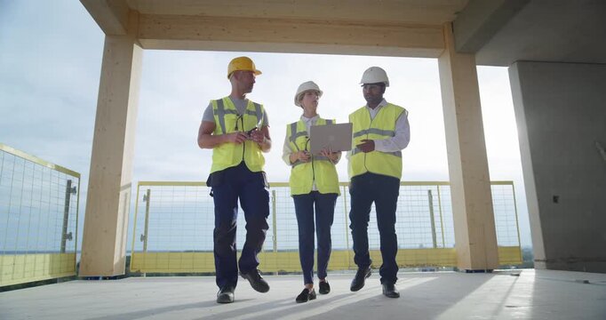 Three Professional Engineers Analyze Laptop Plans, Talk about Structural Options, Map Future Commercial Residential Spaces, Coordinating  Building Design, Tenant Flow, Real Estate Business Property