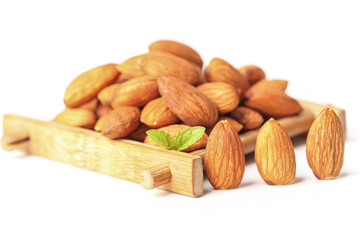 Fresh Almonds on Wooden Board with Mint Leaf © BuiVan