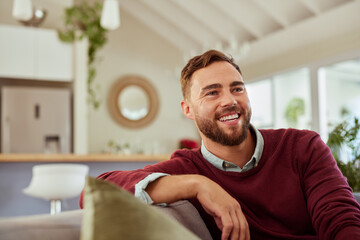 Happy mid adult man in casual smiling at home