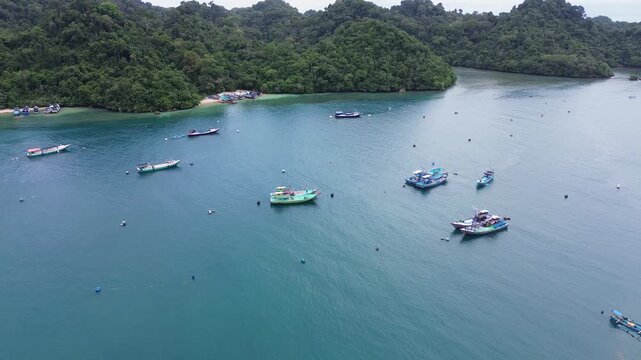 4K Aerial View of Traditional Fishing Village and Colorful Boats at Sendang Biru, Malang