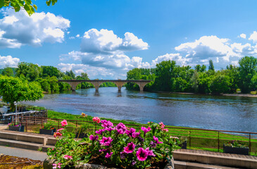 Colourful flowers Limeuil river view the Dordogne France French historic travel destination
