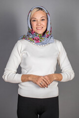 Portrait of a young beautiful woman in Russian folk clothing