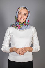 Portrait of a young beautiful woman in Russian folk clothing