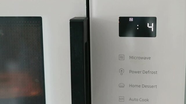 Microwave kitchen appliance cooking white modern digital display oven with digital timer and white interior modern design showing