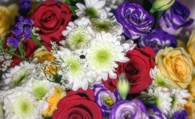 Vibrant floral bouquet with roses and chrysanthemum.