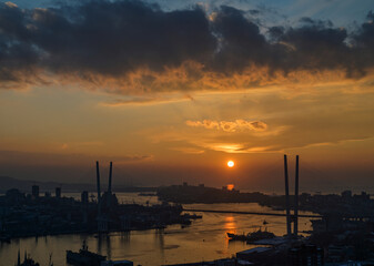 Dramatic sunset over the Golden Horn bay: a battle of golden light and clouds.