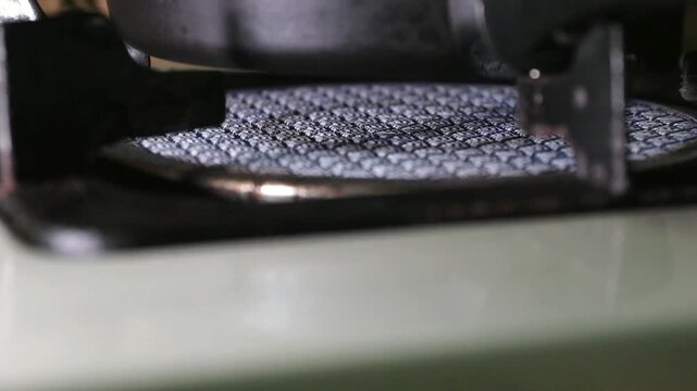 Gas stove burner flame closeup, kitchen heat and fire safety, hot metal grid texture cooking appliance detail