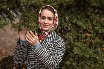 Portrait of a young beautiful woman with a scarf on her head