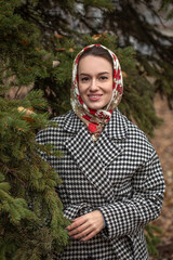 Portrait of a young beautiful woman with a scarf on her head