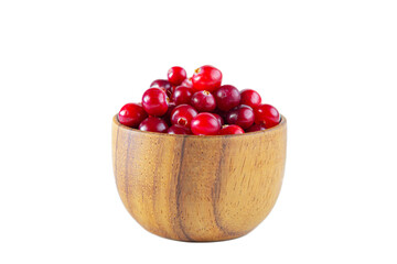 Cranberries in a wooden bowl isolated on a white background.