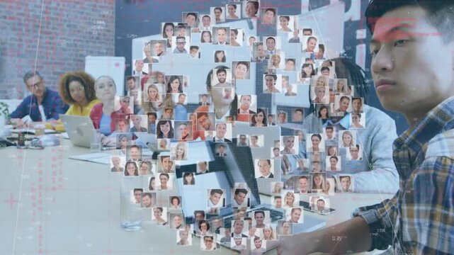 Animation of globe of business profile icons against asian man reading a document at office