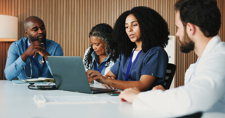 Medical, meeting or doctors in office with laptop, team insight or patient review for treatment plan. Healthcare, people or surgeon with tech, collaboration or client diagnosis in hospital discussion