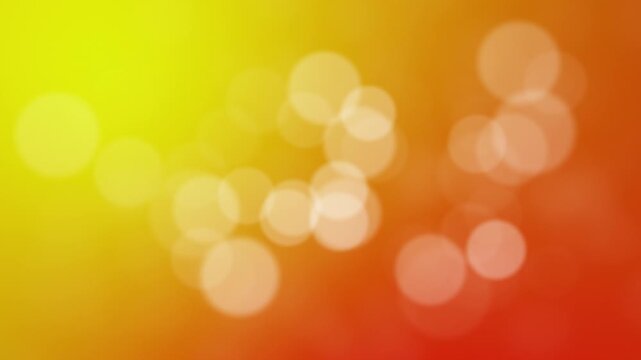 Abstract warm yellow orange gradient background with soft glowing white bokeh lights.Defocused circles floating on colorful red and yellow texture.