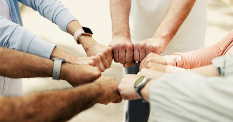 Group, fitness and fist bump in circle for teamwork, unity and support for training outdoor. Hands together, people and collaboration for sports, workout motivation and community huddle for synergy