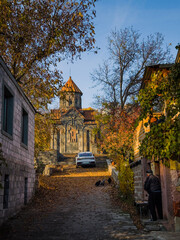 An iconic image of Armenia with a church. A sunny autumn rural landscape. A backdrop for a conceptual journey. High quality photo