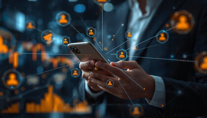 A businessman in a suit uses a smartphone with social network connections and data visualization in the background.