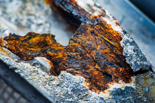 Rusted metal structure showing intense corrosion damage