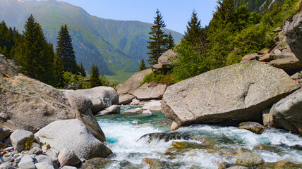 Rhone Glacier and crystal-clear glacial stream in the Swiss Alps, showcasing pristine alpine nature.