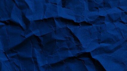 Crumpled dark blue paper background with wavy texture. Abstract recycled kraft paper surface....