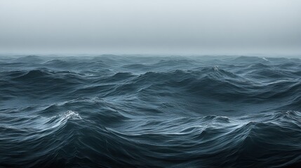 Vast, dark sea; ominous waves under a gray sky