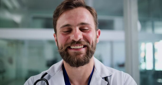 Happy, man and face of doctor in hospital with pride for medical service, support and help. Smile, portrait and male healthcare worker in clinic with confidence, career growth and about us in Germany