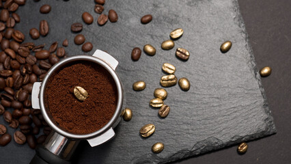 Espresso portafilter filled with ground coffee featuring a single golden coffee bean, surrounded by...