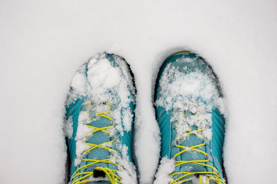 Winter Boots Snow Covered Waterproof Trekking Shoes for Children in Snow Background. Warm and Fashionable.