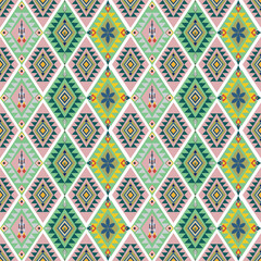 Green, yellow, and pale red seamless pattern with tribal Aztec ornament. Vector illustration. Native American design pattern. Ideas for rugs, tiles, pottery, and textiles.