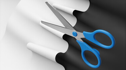 Blue handled scissors cutting through white paper to reveal a contrasting black surface