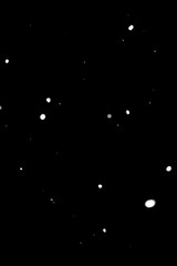 Snow particles texture on black background. High quality photo