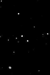 Minimal snow particles on black background. High quality photo