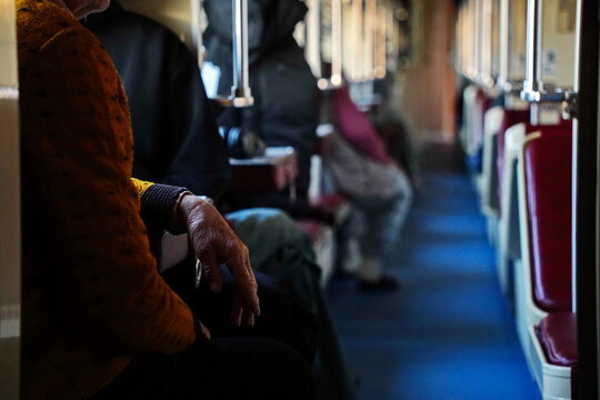 Passengers in the reserved carriage of the train.