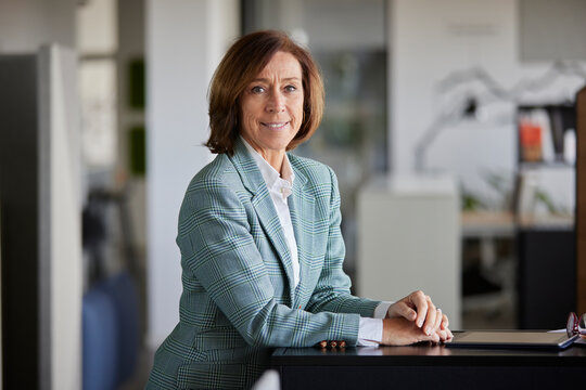Senior businesswoman standing at work place