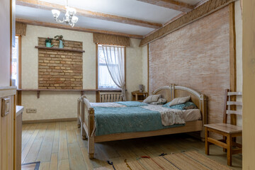 Rustic bedroom interior with woven wall texture and brick decor