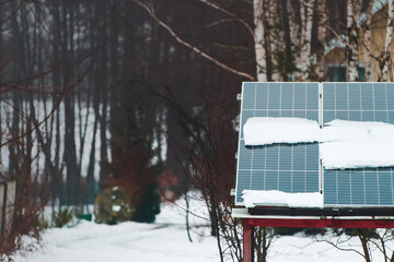 Solar energy panels with snow outdoor view