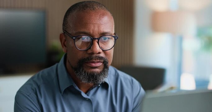 Reading, mature or businessman with glasses in office, review banking transaction or process deposit. Account clerk, tech reflection or black person with invoice for approval, admin or finance record