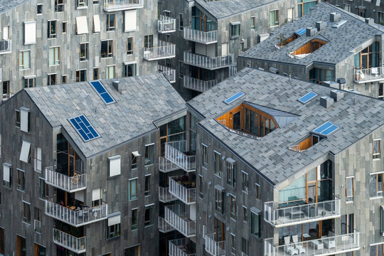 Architecture urban housing residential rooftops solar skylight modern Oslo Bispevika aerial view of new waterfront apartments in daylight