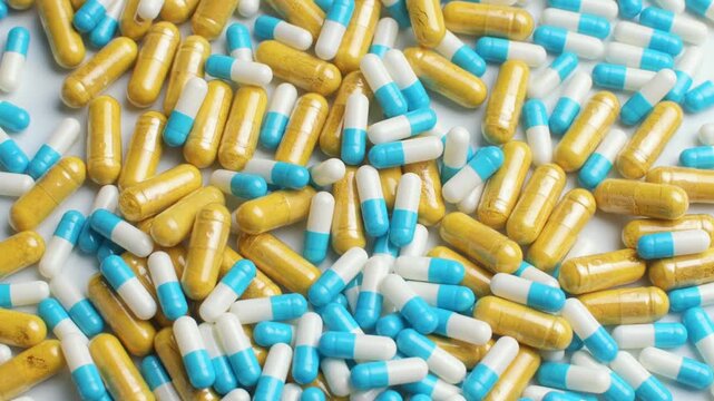 Mixed prescription pills and dietary supplements scattered on white background, concept polypharmacy, overdose risk, choice.