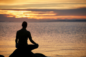 Sunset, meditation and shadow of man by ocean for reflection, mindfulness and peace in nature....
