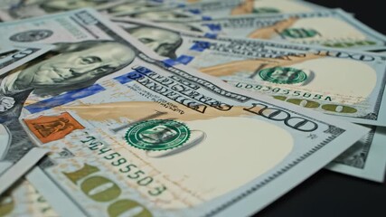 Stack of US hundred dollar bills