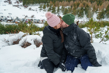 Couple kissing deeply embracing a romantic winter moment