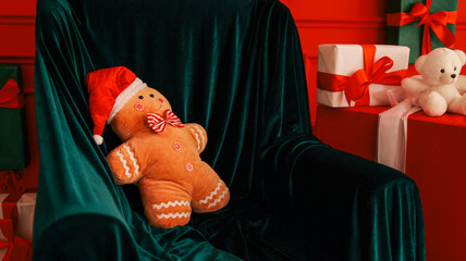 Cozy Christmas scene with gingerbread man plush toy and gifts on a velvet armchair