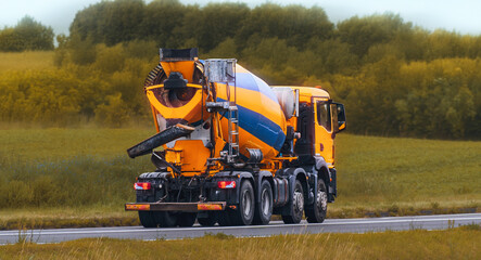 Large industrial cement mixer truck on highway